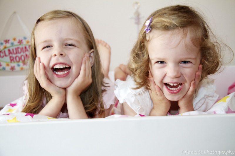 Sisters laughing - family portrait photography